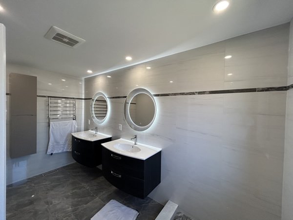 Bathroom renovation with dark vanity and tile GTA