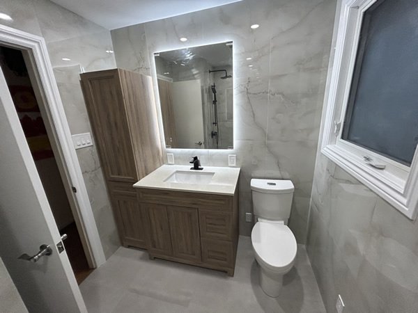 Bathroom remodel with floating vanity and marble tile GTA